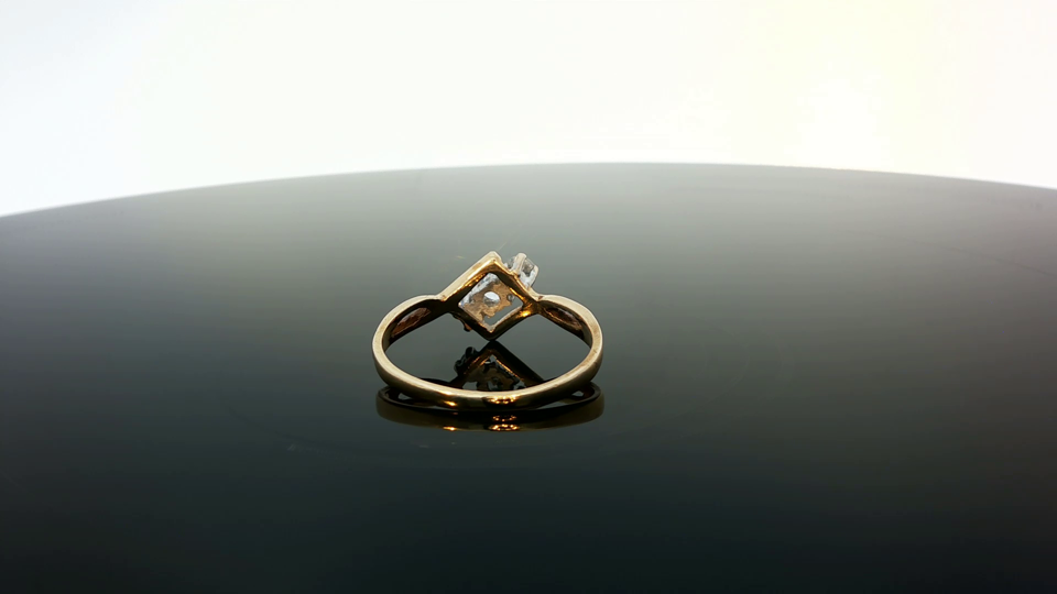 9ct yellow gold ring with smooth band, unbranded jewelry piece, detailed close-up showing polished finish and rounded edges.