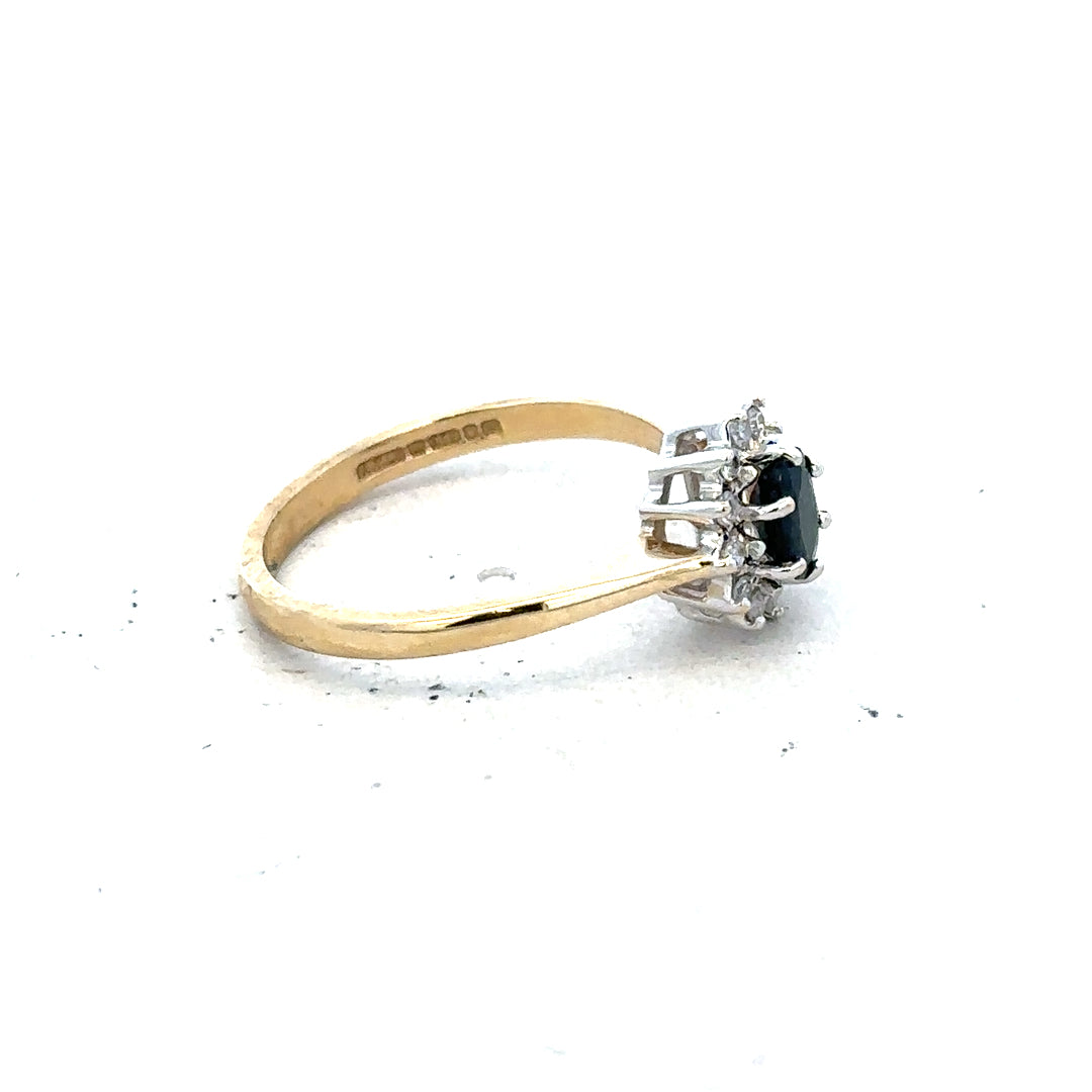 9ct yellow gold sapphire and diamond ring in size L with a detailed band design, unbranded jewelry piece.
