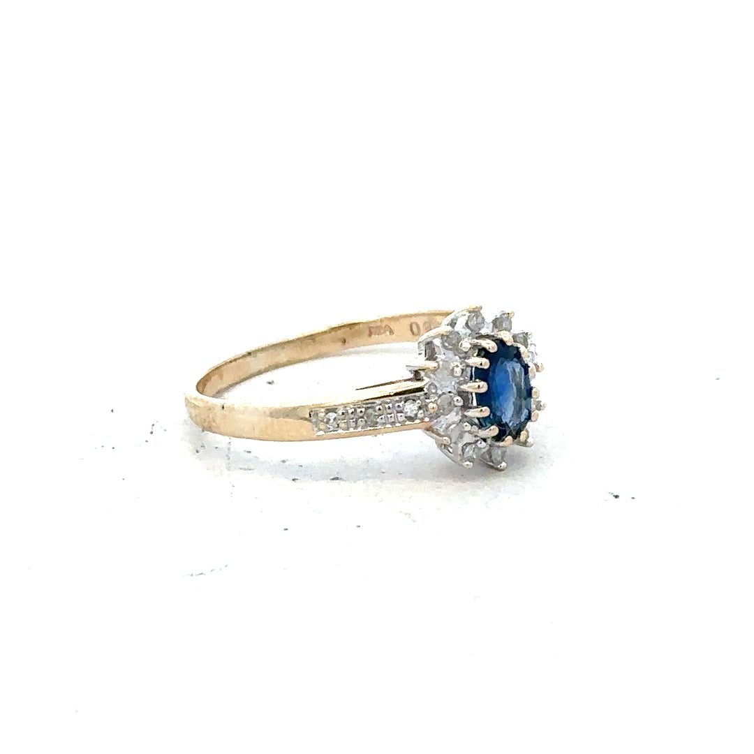 9ct yellow gold sapphire and diamond ring, size P1/2, featuring a central sapphire gemstone and sparkling diamonds.