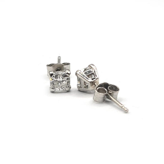 Platinum 1.00 carat GIA Certified diamond stud earrings with color G and clarity VS2, featuring round diamonds on classic studs.