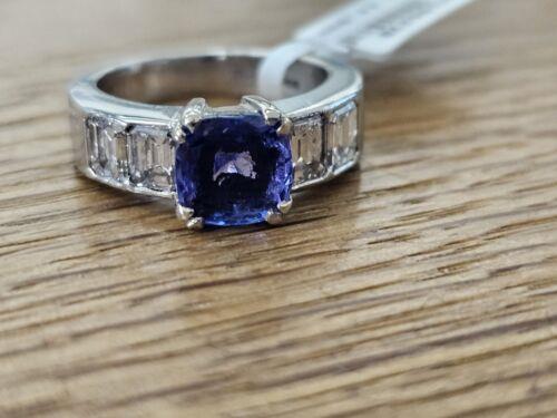 Platinum ring featuring a 1.79-carat tanzanite center stone accented with 1.60-carat diamonds, elegant and sparkling jewelry piece.