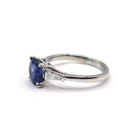 Platinum ring featuring a 1.85 carat blue sapphire center stone and 0.20 carat diamond accents.