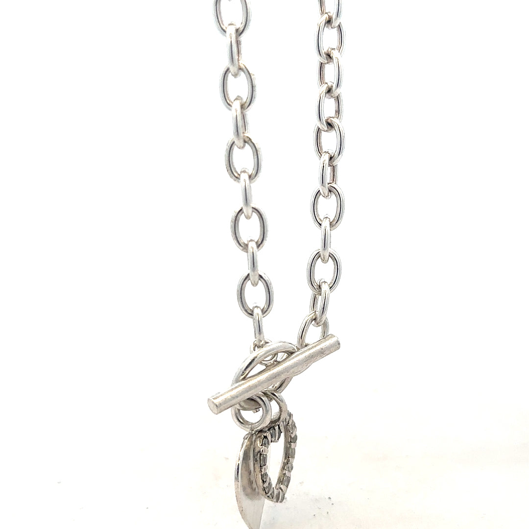 Silver bracelet weighing 19.5g with a sleek design, featuring a shiny finish and a secure clasp.