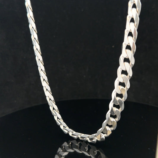 Silver curb chain weighing 60.4g, featuring classic linked design, crafted for durable and stylish jewelry.