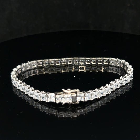 Silver tennis bracelet weighing 15.6g with a sleek design, featuring linked silver segments for a stylish and elegant look.