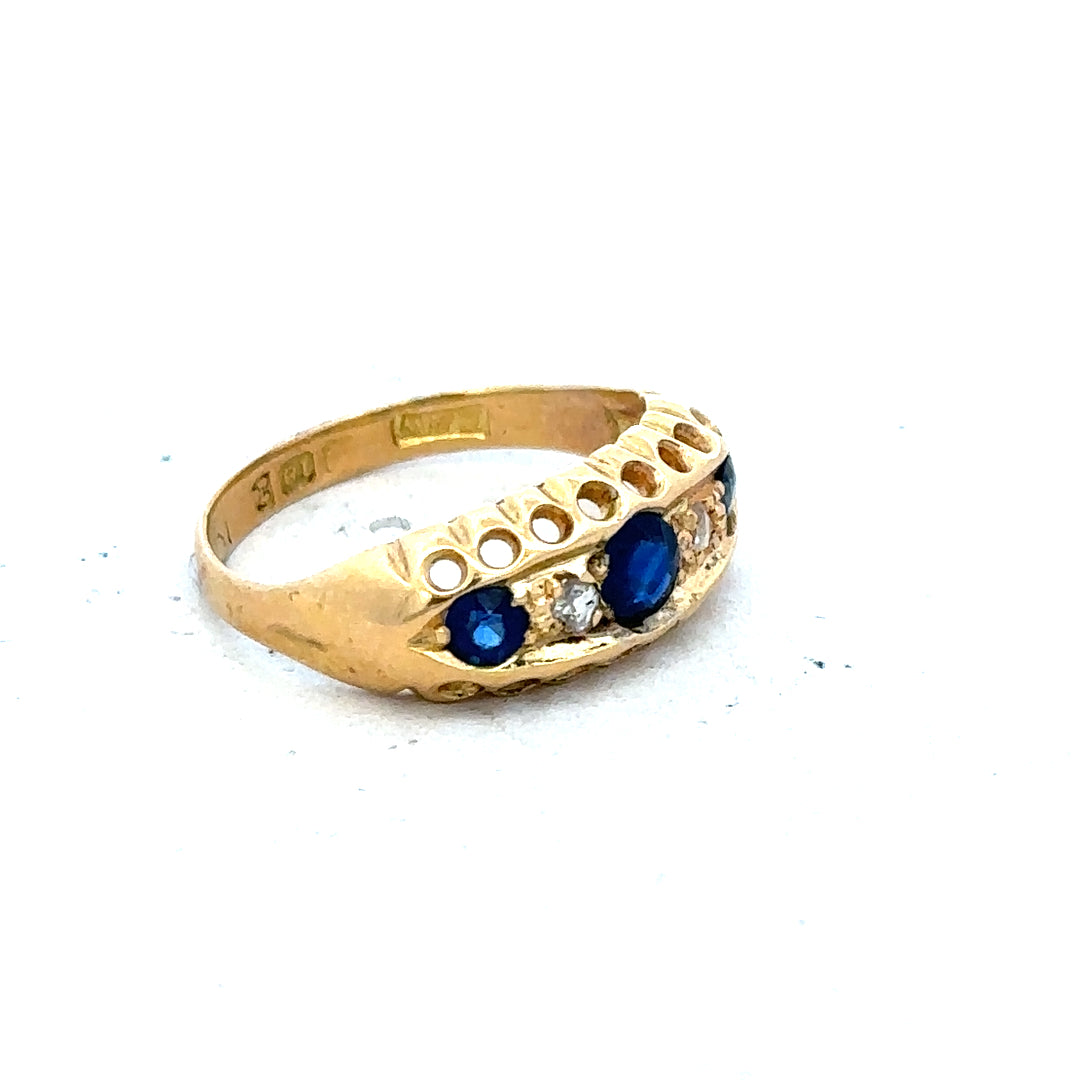 Vintage 18ct yellow gold sapphire and diamond ring, showcasing a detailed design with vibrant gemstones and elegant craftsmanship.