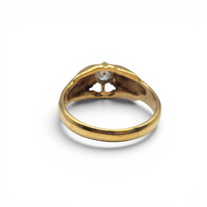 9ct yellow gold diamond ring by Reeves and Sons with sparkling diamonds and a polished band, displayed on a white background.
