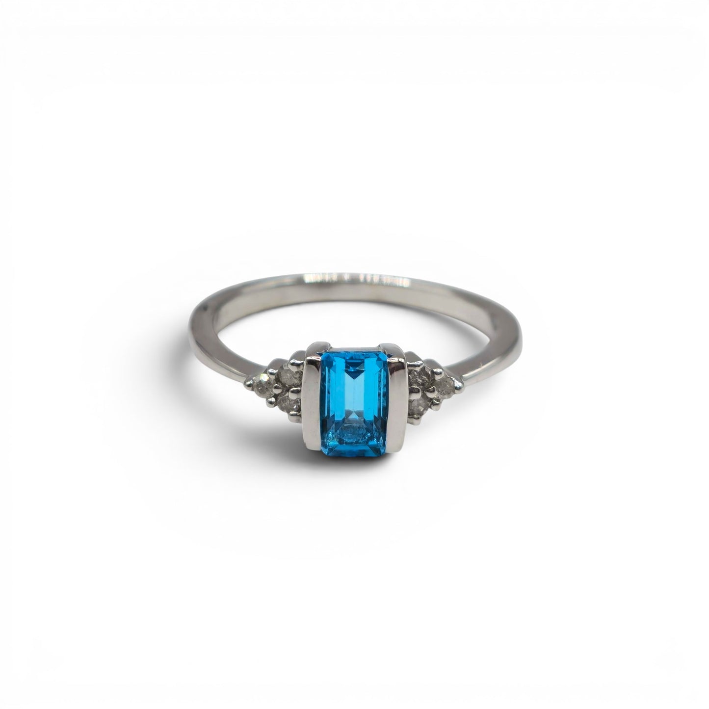 9ct white gold ring with topaz and diamond accents, Reeves and Sons jewelry, close-up of detailed gemstone and metal design
