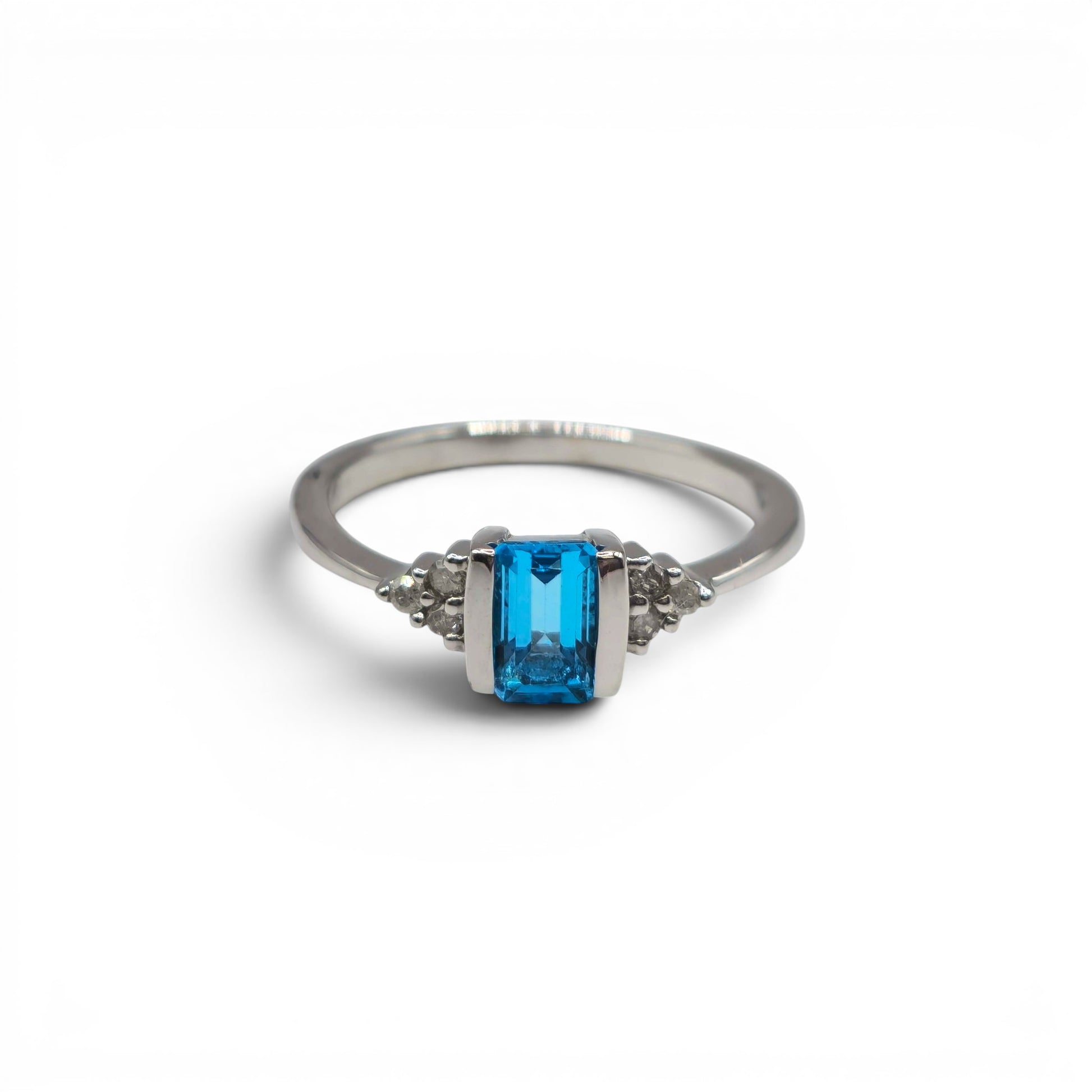 9ct white gold ring with topaz and diamond accents, Reeves and Sons jewelry, close-up of detailed gemstone and metal design