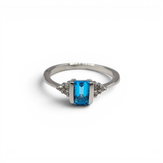 9ct white gold ring with topaz and diamond accents, Reeves and Sons jewelry, close-up of detailed gemstone and metal design