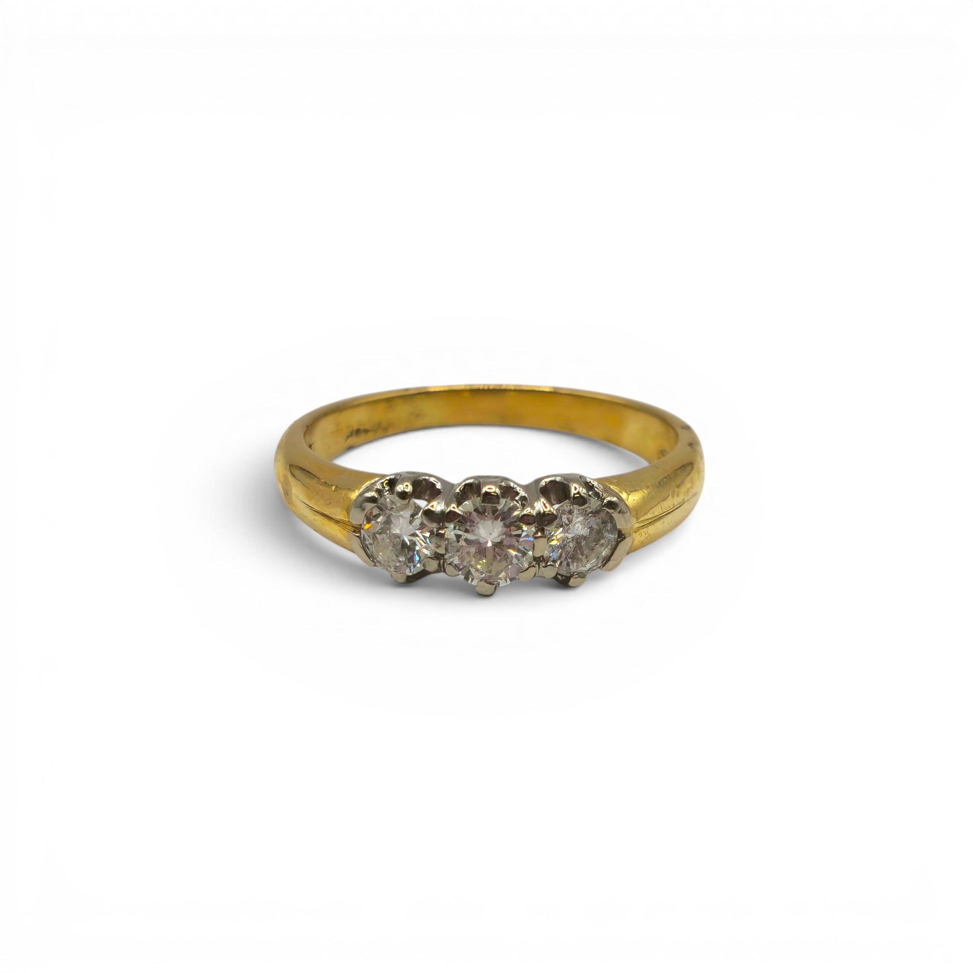 18ct yellow gold three stone diamond ring by Reeves and Sons, showcasing sparkling diamonds and elegant craftsmanship.