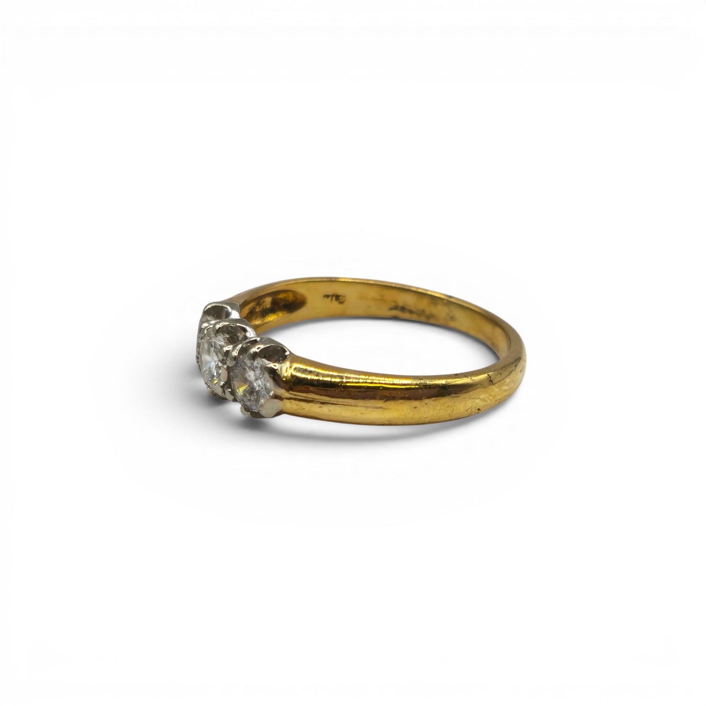 18ct yellow gold three stone diamond ring by Reeves and Sons with sparkling diamonds and elegant design.
