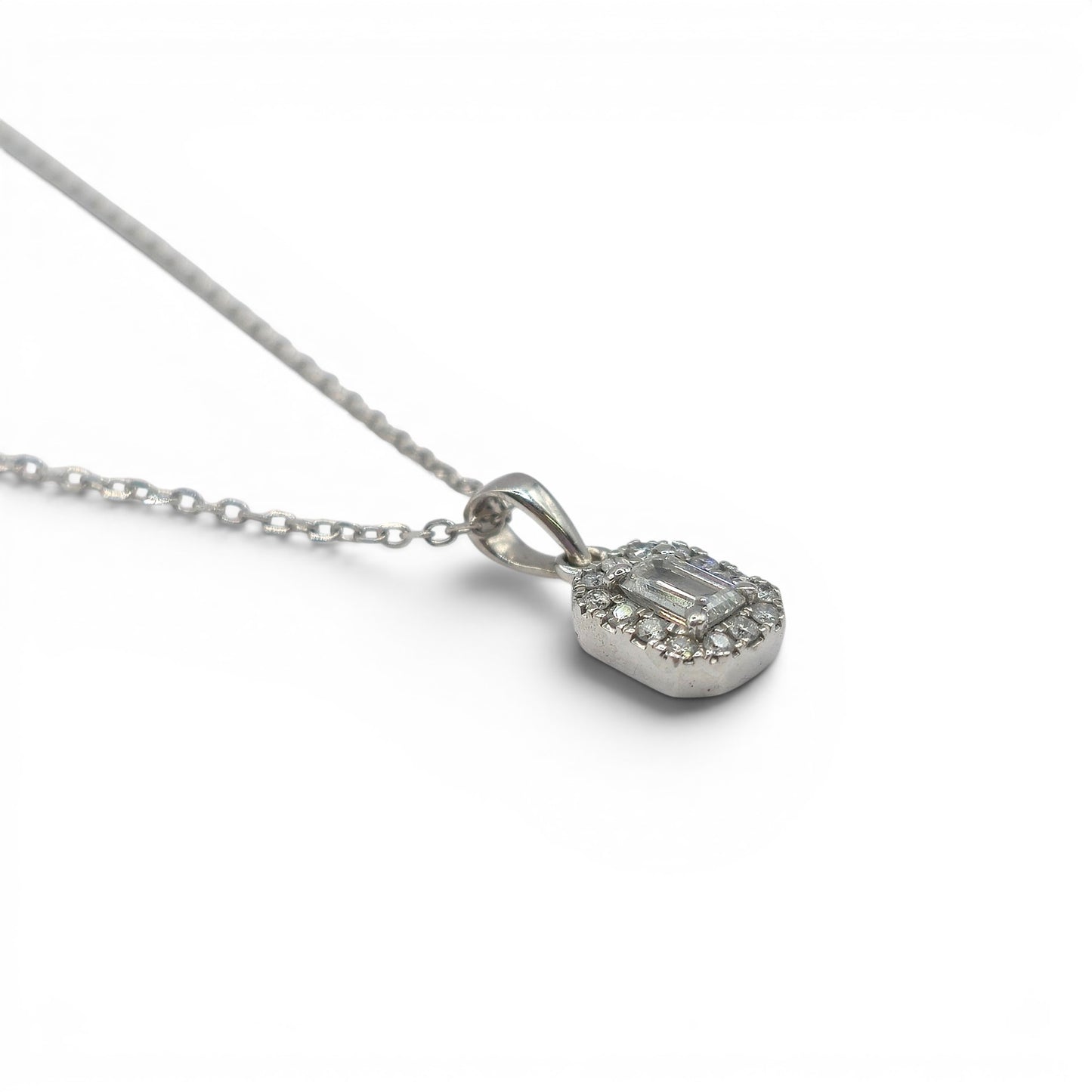 Reeves and Sons 18ct white gold diamond cluster pendant chain, featuring sparkling diamond accents and intricate gold detailing.