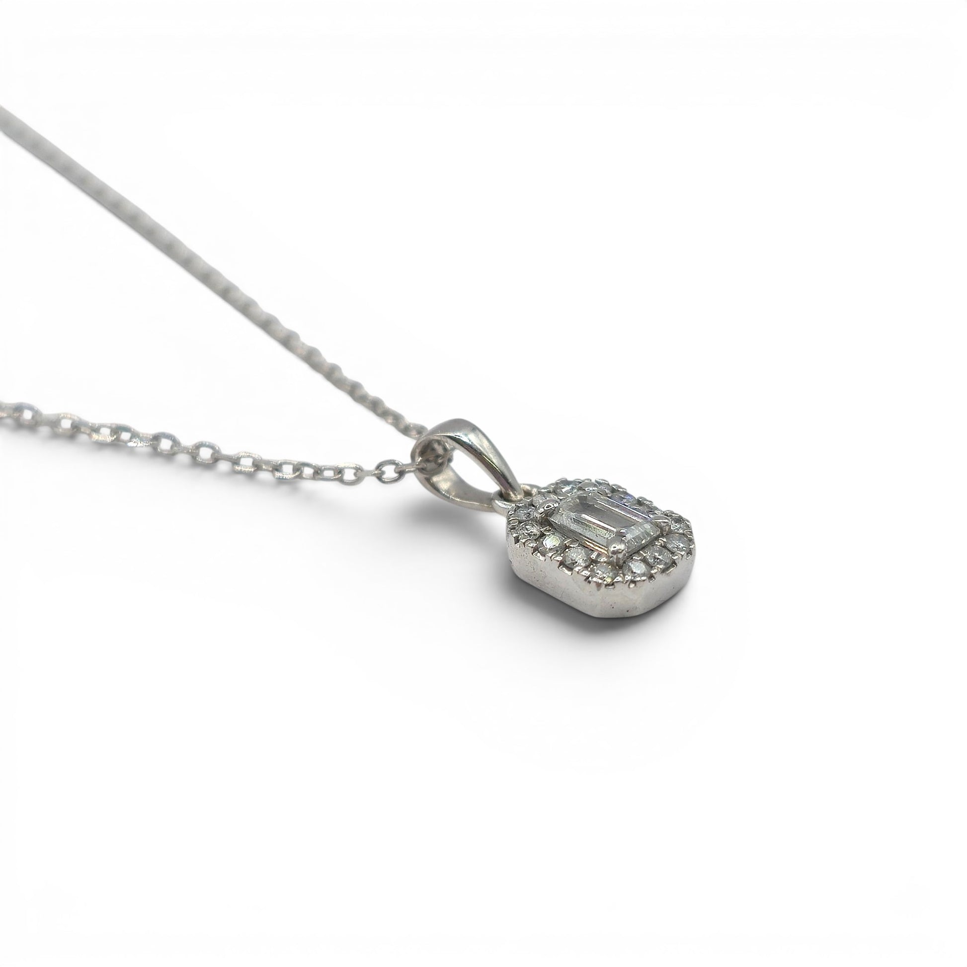 Reeves and Sons 18ct white gold diamond cluster pendant chain, featuring sparkling diamond accents and intricate gold detailing.