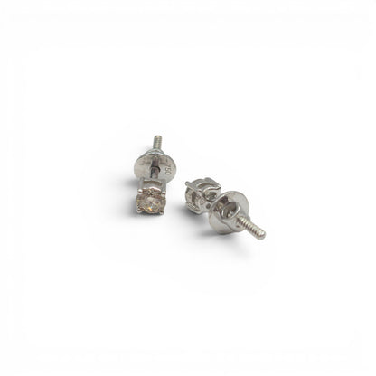 18ct white gold diamond stud earrings by Reeves and Sons, featuring sparkling diamonds set in a classic design.