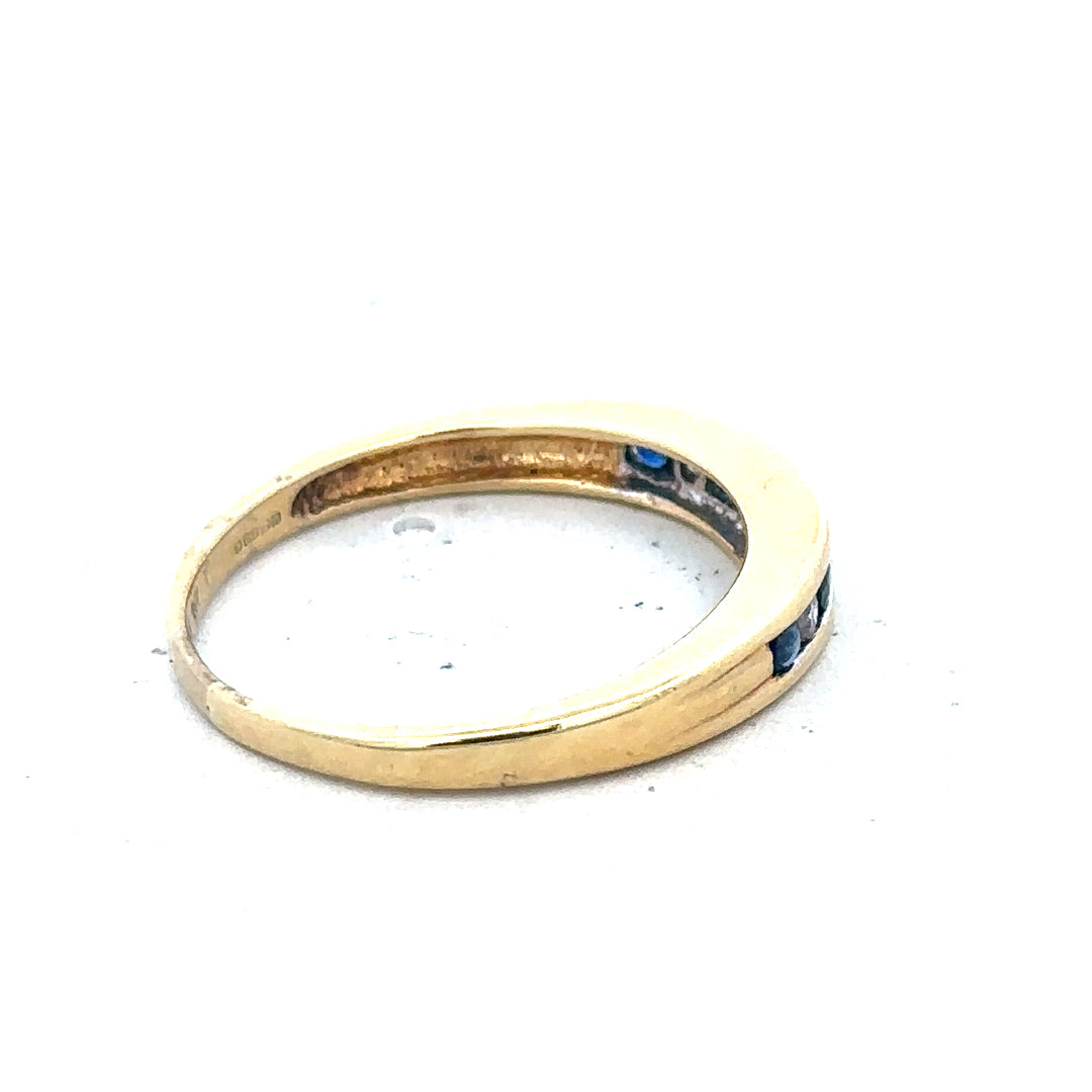 18ct yellow gold sapphire and diamond ring, size S, featuring a central sapphire gemstone with diamond accents.