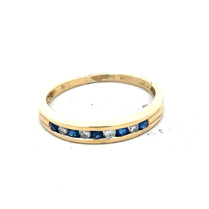 18ct yellow gold sapphire and diamond ring, size S, featuring a central blue sapphire surrounded by sparkling diamonds.