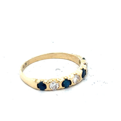 18ct yellow gold diamond and sapphire ring, size M 1/2, featuring a sparkling gemstone design and elegant craftsmanship.
