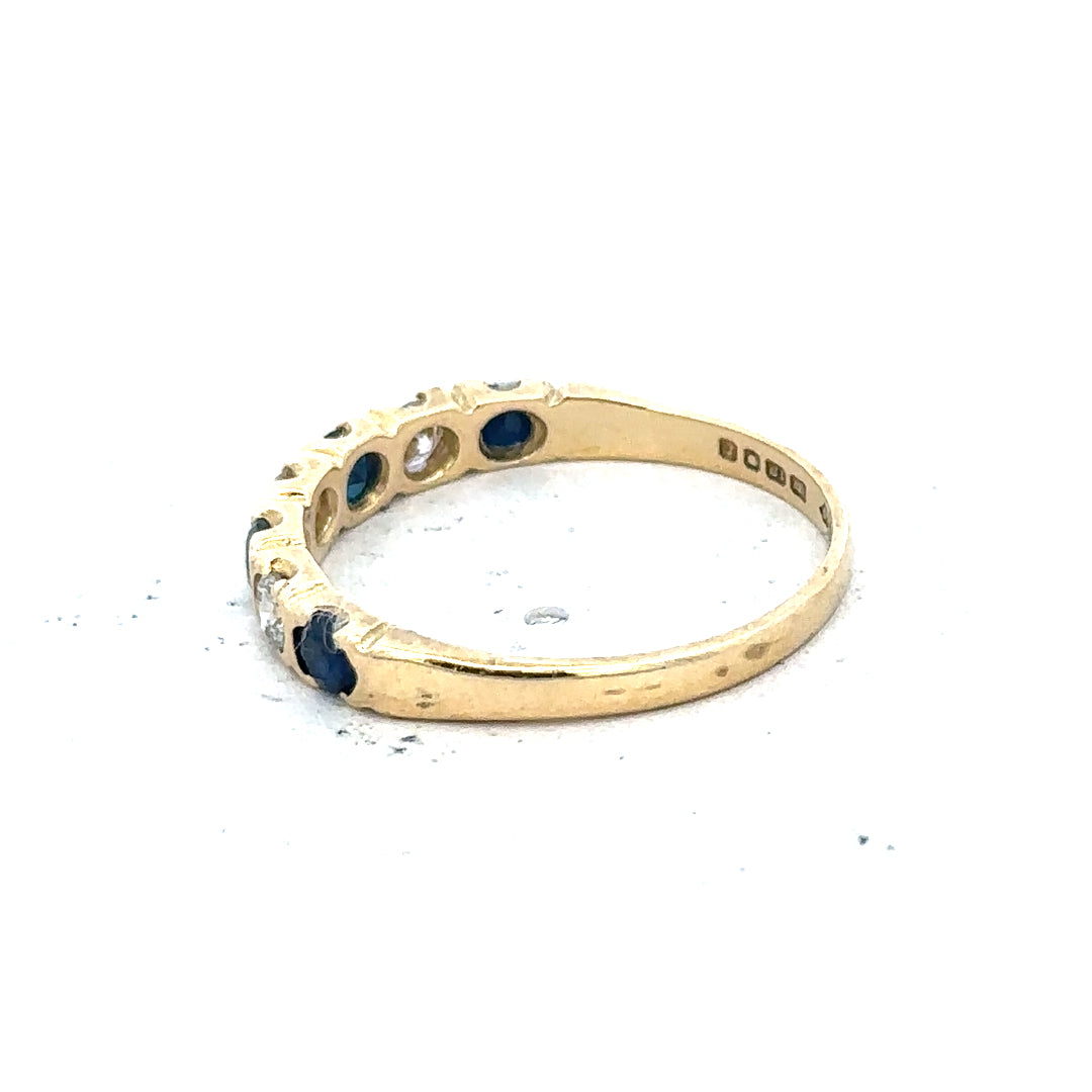 18ct yellow gold diamond and sapphire ring, size M 1/2, featuring sparkling gemstones and elegant gold band.