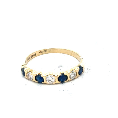 18ct yellow gold diamond and sapphire ring in size M 1/2, featuring sparkling gemstones and a classic band design.