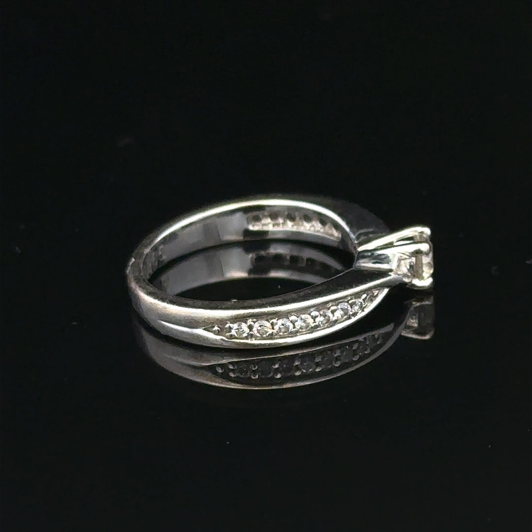 18ct white gold diamond ring with 1/3 carat round cut diamond in size J, featuring a sleek and elegant design.