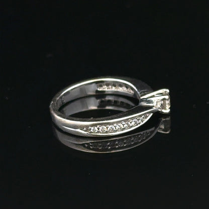 18ct white gold diamond ring with 1/3 carat round cut diamond in size J, featuring a sleek and elegant design.
