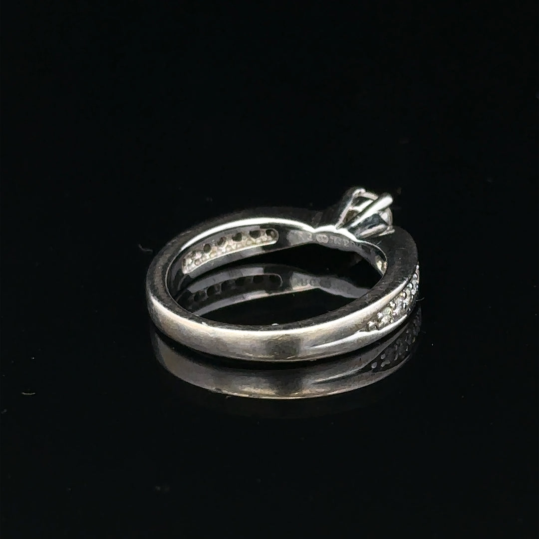 18ct white gold diamond ring with 1/3 carat round diamond, size J, featuring elegant design and sparkling gemstone.