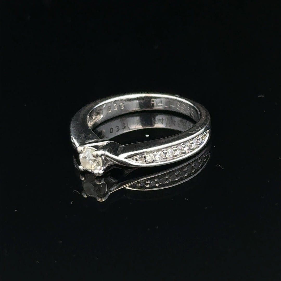 18ct white gold diamond ring with 1/3 carat center stone, size J, featuring a delicate, elegant design.