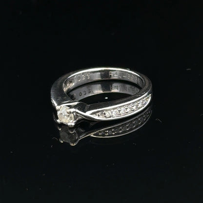 18ct white gold diamond ring with 1/3 carat center stone, size J, featuring a delicate, elegant design.