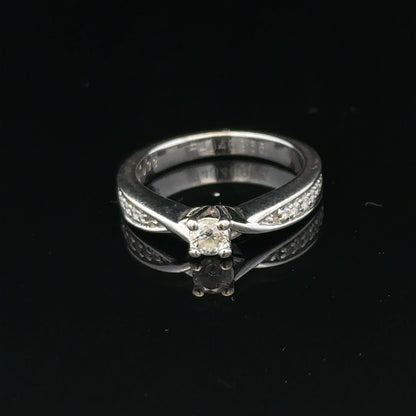 18ct white gold diamond ring with 1/3 carat total weight, size J, featuring sparkling diamonds and a sleek, elegant design.