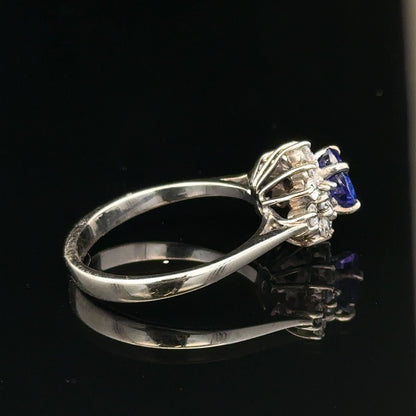 18ct white gold diamond and tanzanite ring in size O, featuring a sparkling gemstone design.