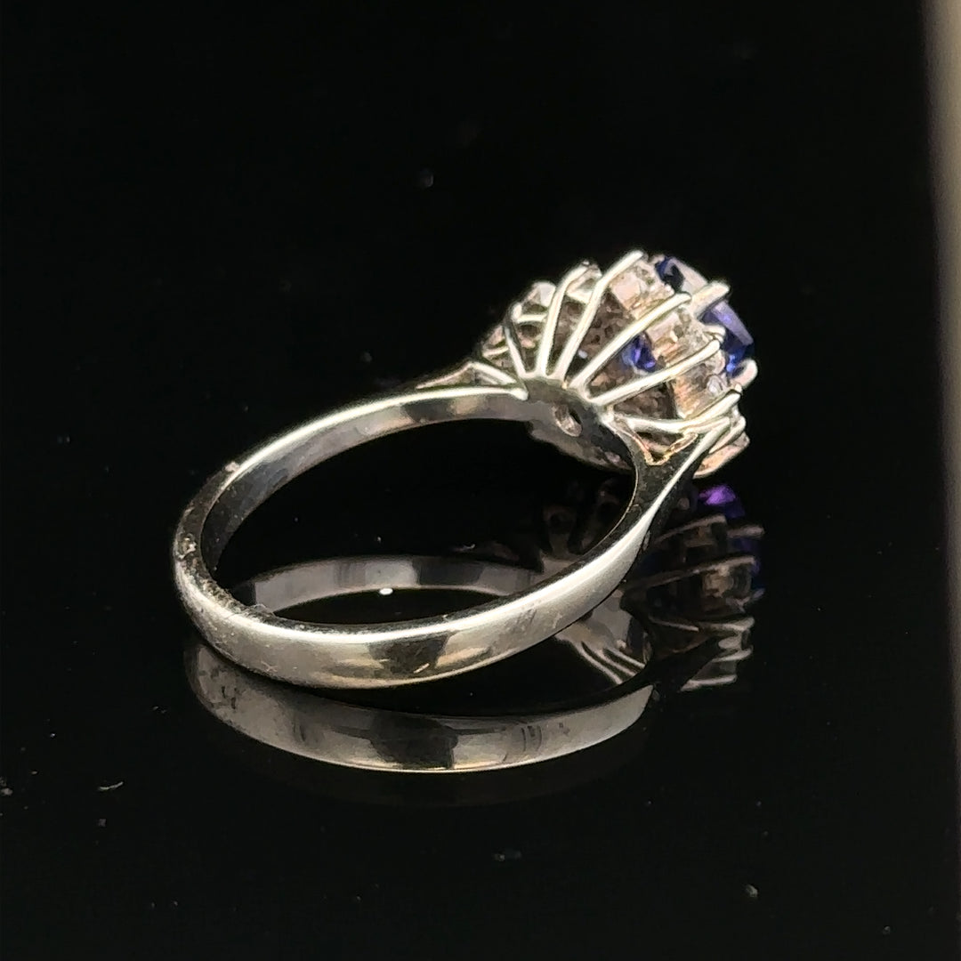 18ct white gold diamond and tanzanite ring in size O with sparkling gemstones and intricate band design.