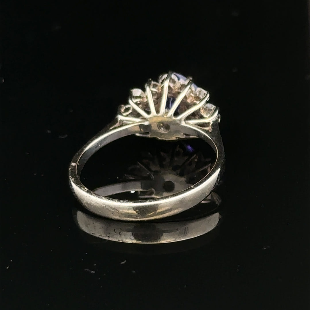 18ct white gold diamond and tanzanite ring size O, featuring sparkling gemstones and a sleek band design.