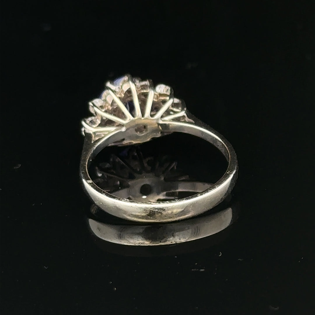 18ct white gold diamond and tanzanite ring in size O, showcasing sparkling stones set in elegant jewelry design