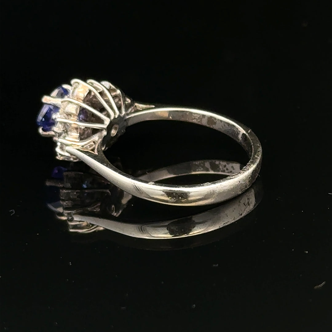 18ct white gold diamond and tanzanite ring in size O, featuring a sparkling gemstone design and elegant craftsmanship.