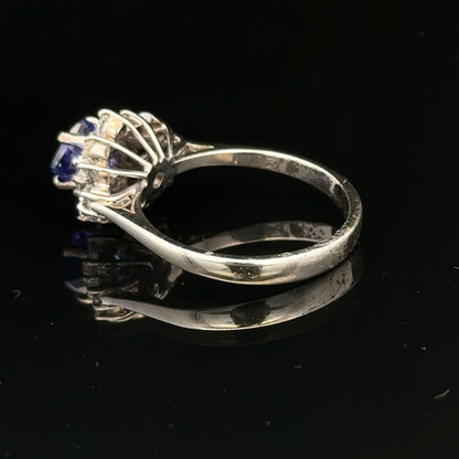18ct white gold diamond and tanzanite ring in size O, featuring a sparkling gemstone design and elegant craftsmanship.