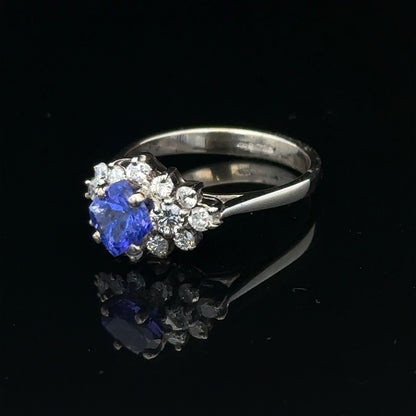 18ct white gold diamond and tanzanite ring in size O, featuring a sparkling gemstone design and elegant craftsmanship.