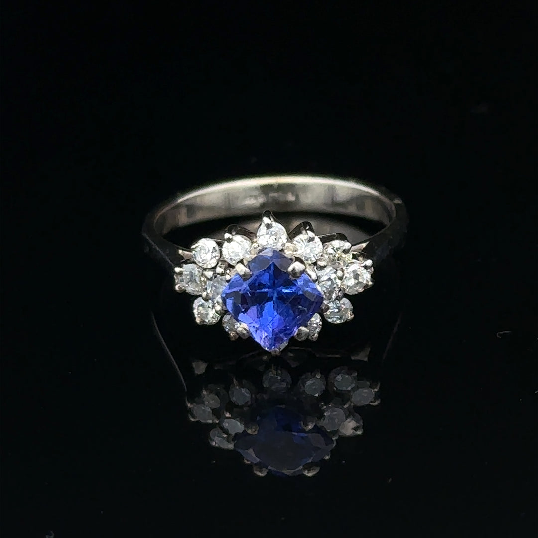 18ct white gold diamond and tanzanite ring, size O, featuring sparkling gemstones and elegant design.