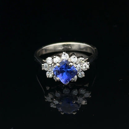 18ct white gold diamond and tanzanite ring, size O, featuring sparkling gemstones and elegant design.