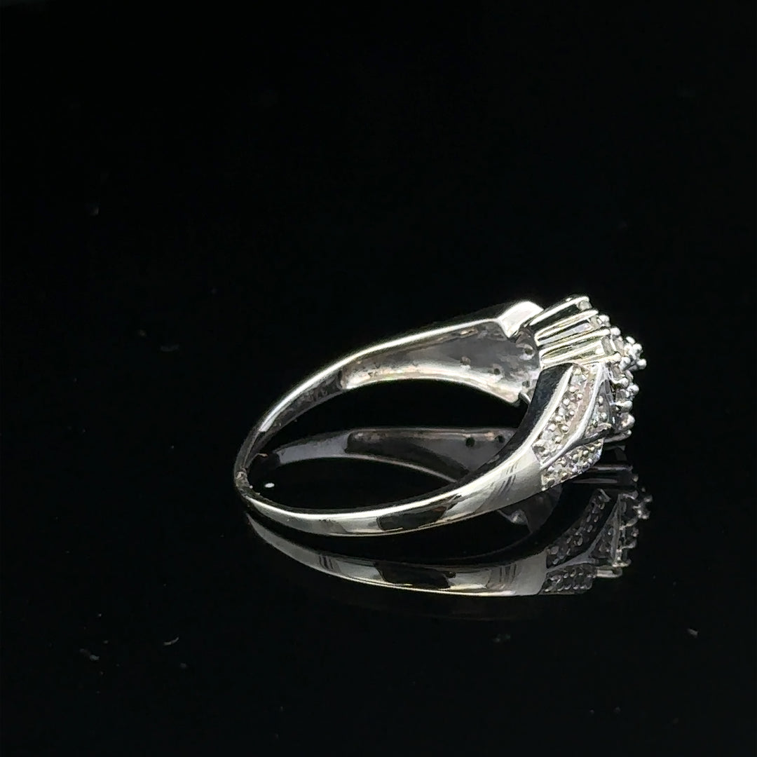 9ct white gold diamond ring in size M, featuring sparkling diamonds and a sleek design, weighs 2.6 grams.