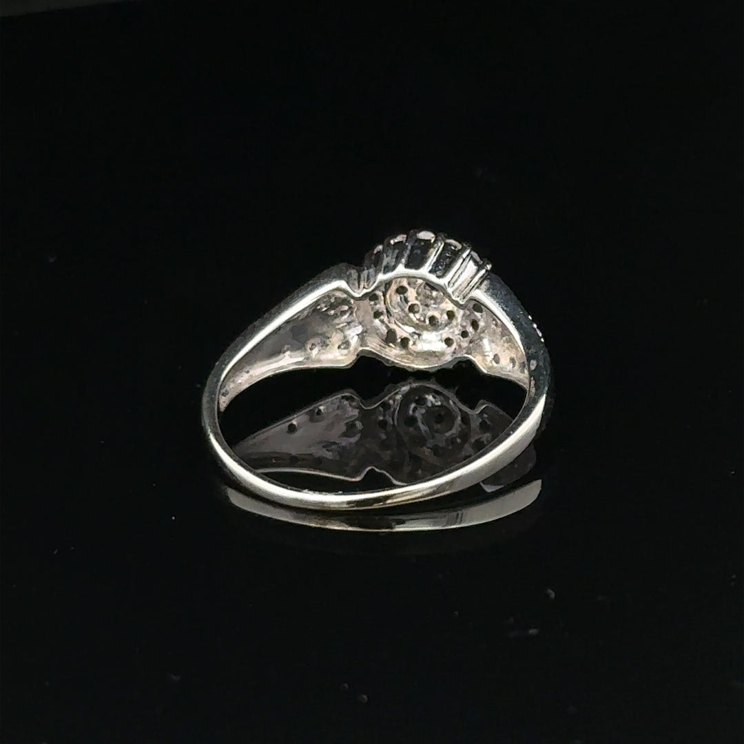 9ct white gold diamond ring in size M, featuring sparkling diamonds and a sleek design, weighing 2.6 grams.