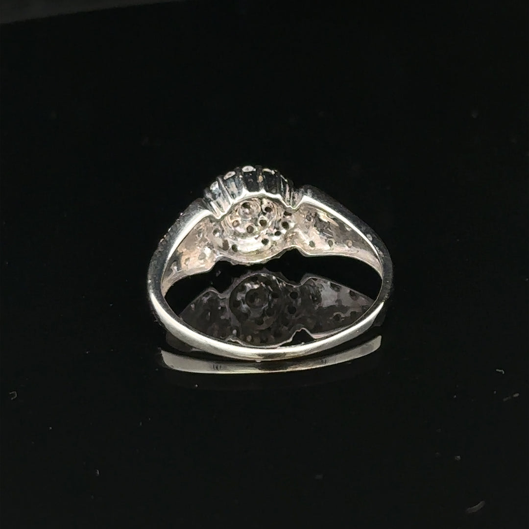 9ct white gold diamond ring in size M with 2.6g, featuring a sparkling diamond design.