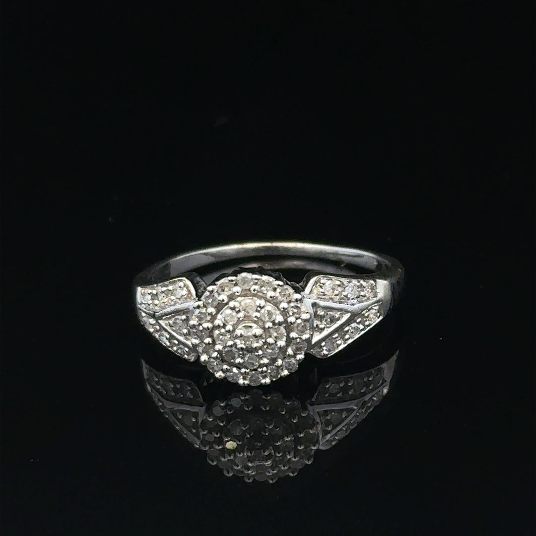 9ct white gold diamond ring in size M featuring sparkling diamonds, weighing 2.6 grams. Unbranded, elegant jewelry piece.
