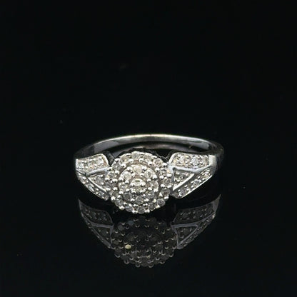 9ct white gold diamond ring in size M featuring sparkling diamonds, weighing 2.6 grams. Unbranded, elegant jewelry piece.