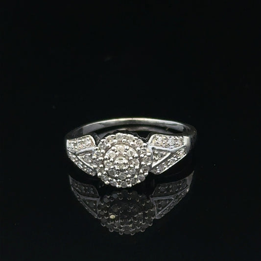 9ct white gold diamond ring in size M featuring sparkling diamonds, weighing 2.6 grams. Unbranded, elegant jewelry piece.