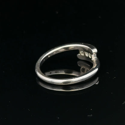 18ct white gold diamond ring, size M.5, with sparkling diamonds, weighs 4.2g, unbranded jewelry shown in detailed close-up image.