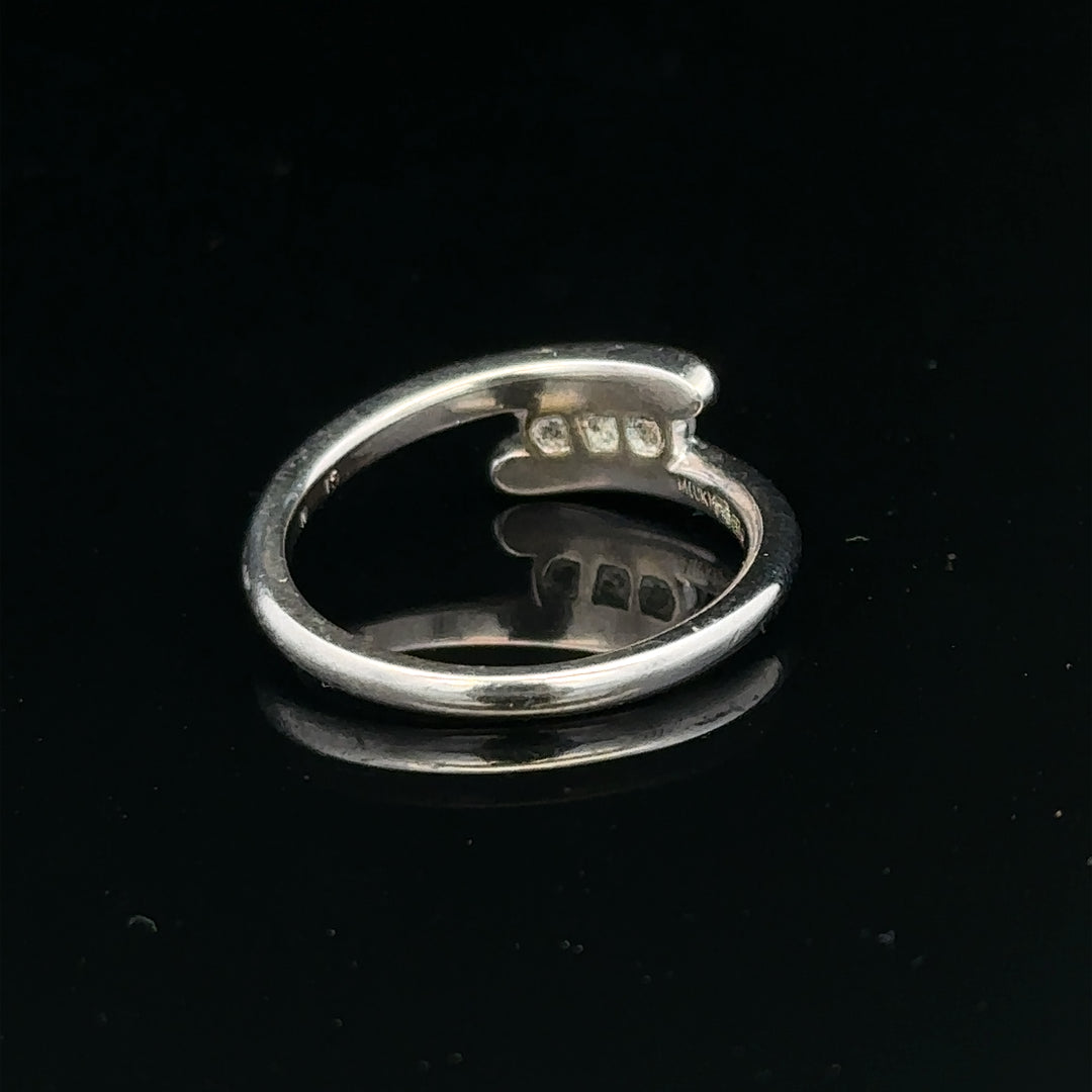 18ct white gold diamond ring in size M.5 with 4.2g, featuring sparkling diamonds on a sleek band.