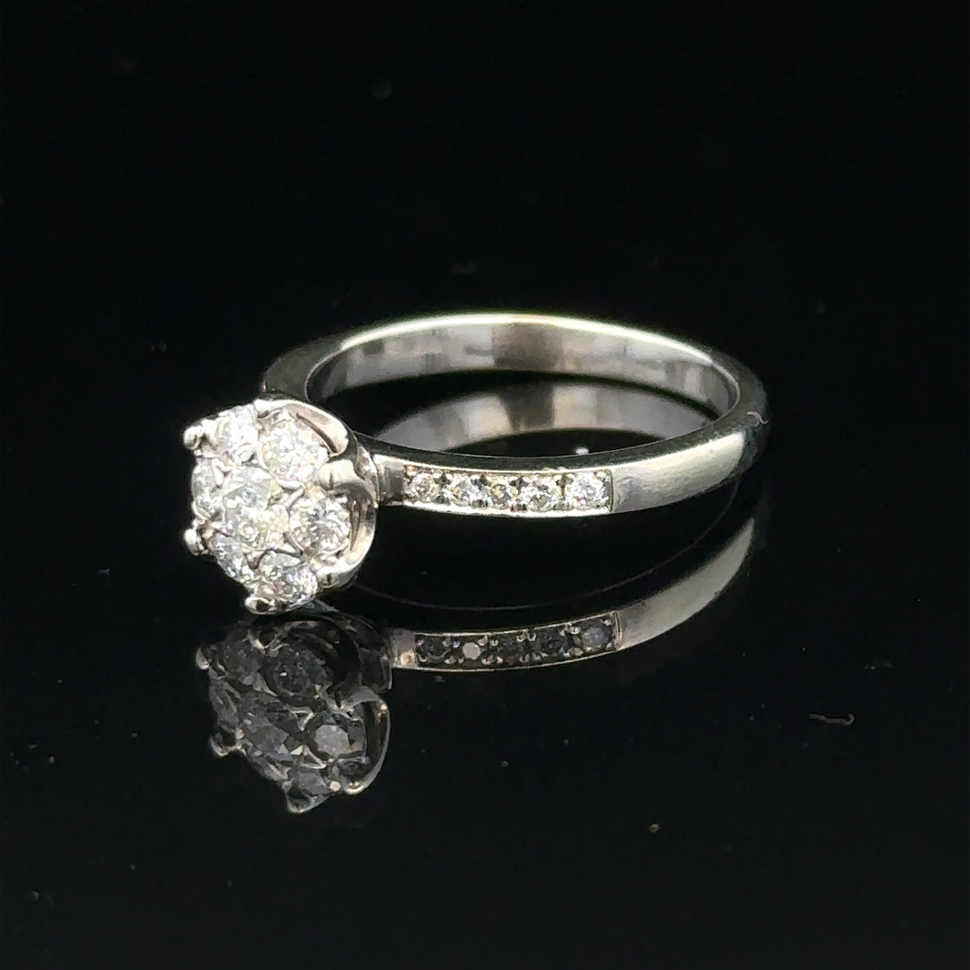 9ct white gold diamond ring, size M, featuring sparkling diamonds and a sleek design, weighs 3.2 grams, unbranded jewelry piece.