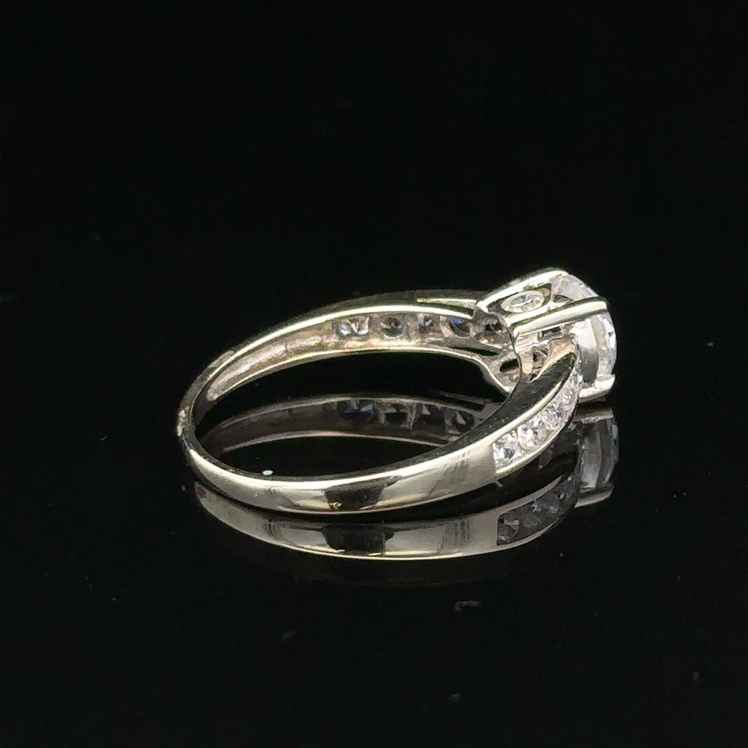 9ct white gold ring in size L 1/2, weighs 2g, featuring a sleek, polished band with a simple, elegant design.