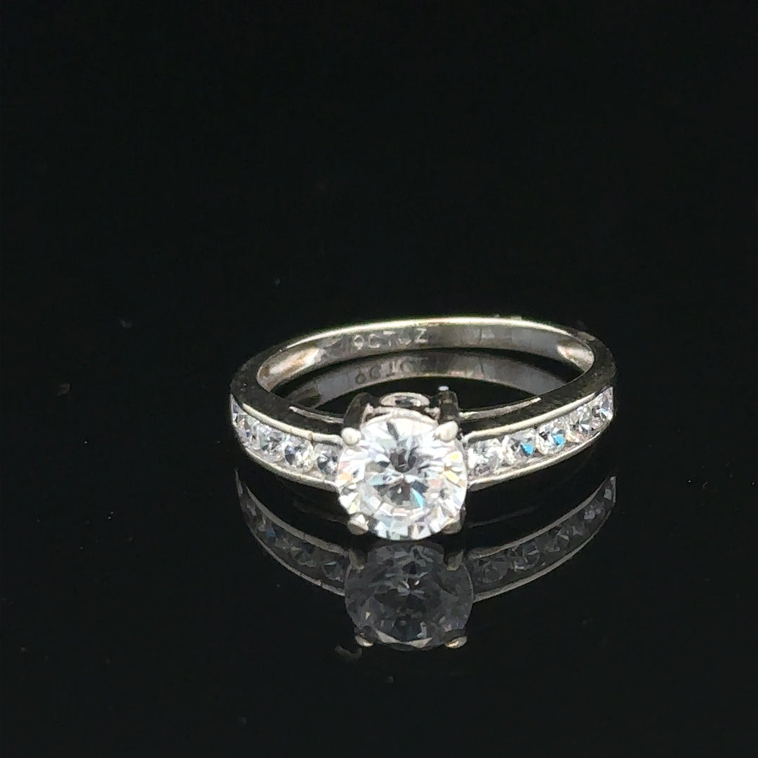 9ct white gold ring in size L 1/2, weighing 2g, featuring a sleek, polished finish. Unbranded jewelry ring displayed.